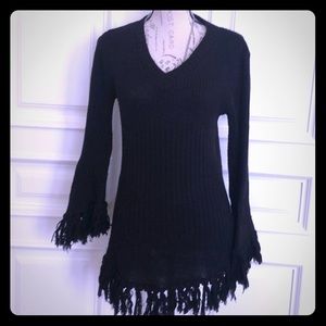 Fun sweater fits like a small